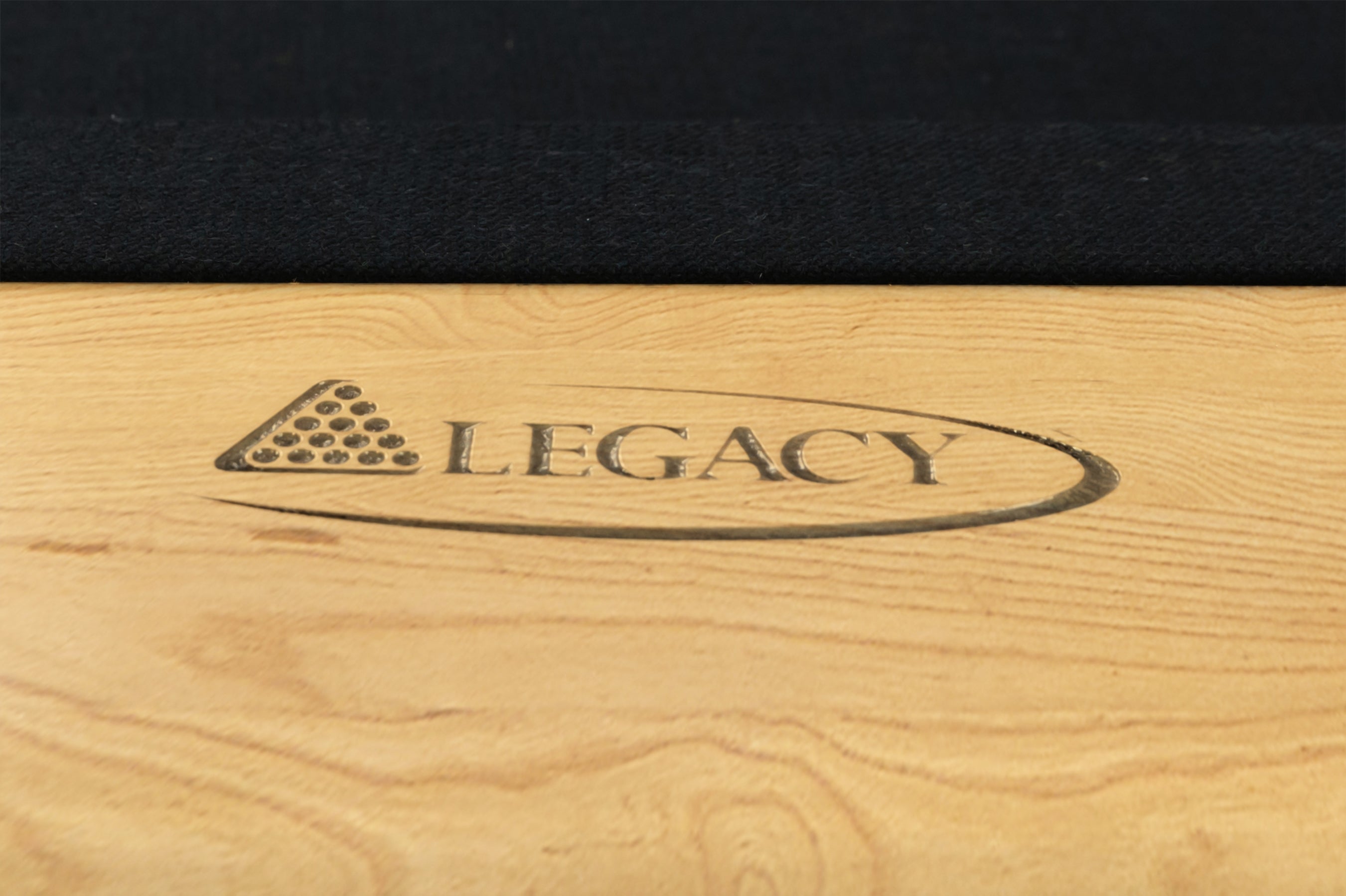Legacy Billiards Richland Pool Table in Honey Ash Finish with Black Cloth - Logo Rail Closeup