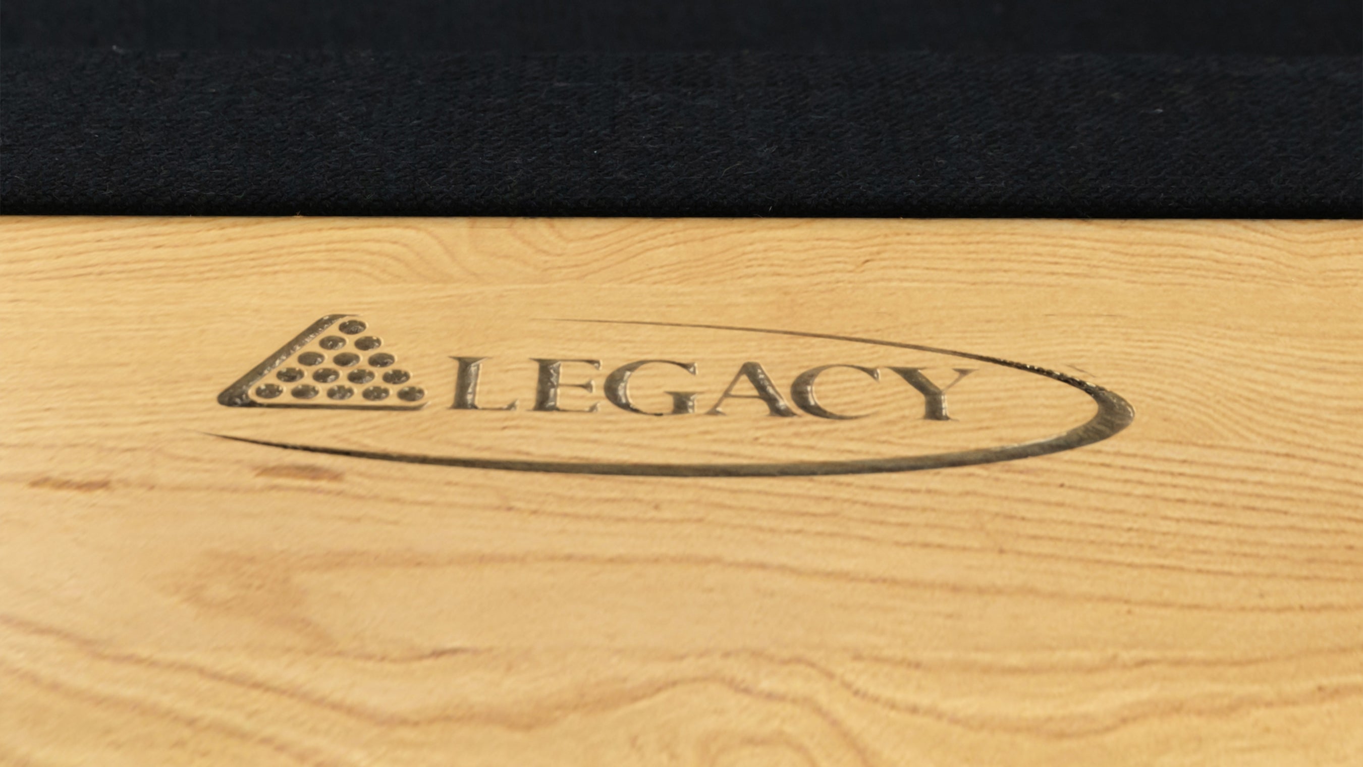 Legacy Billiards Richland Pool Table in Honey Ash Finish with Black Cloth - Logo Rail Closeup