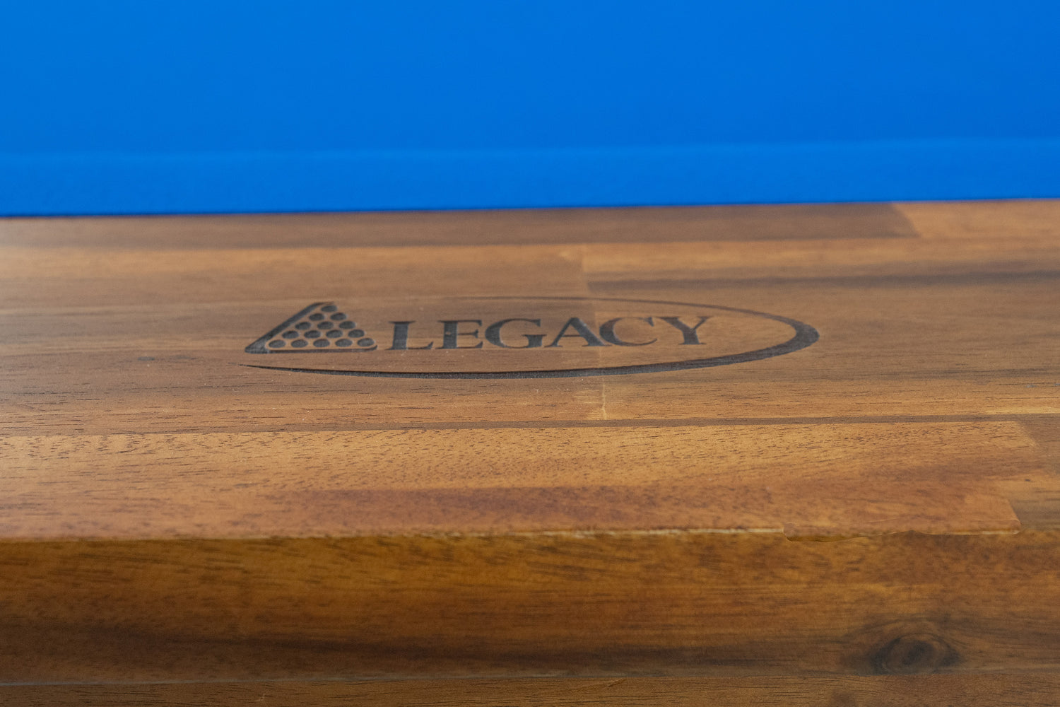 Legacy Billiards Barren Pool Table in Natural Acacia Finish with Blue Cloth - Logo Rail Closeup
