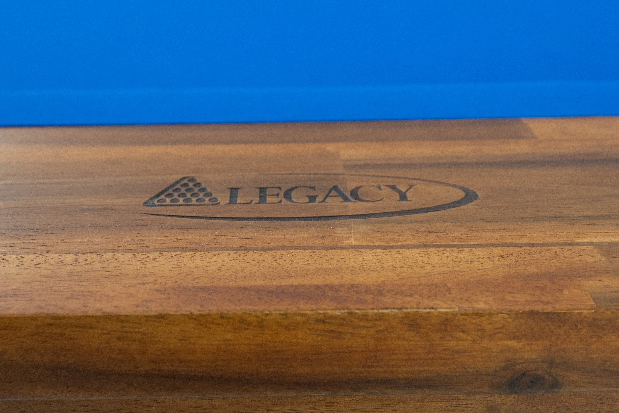 Legacy Billiards Barren Pool Table in Natural Acacia Finish with Blue Cloth - Logo Rail Closeup