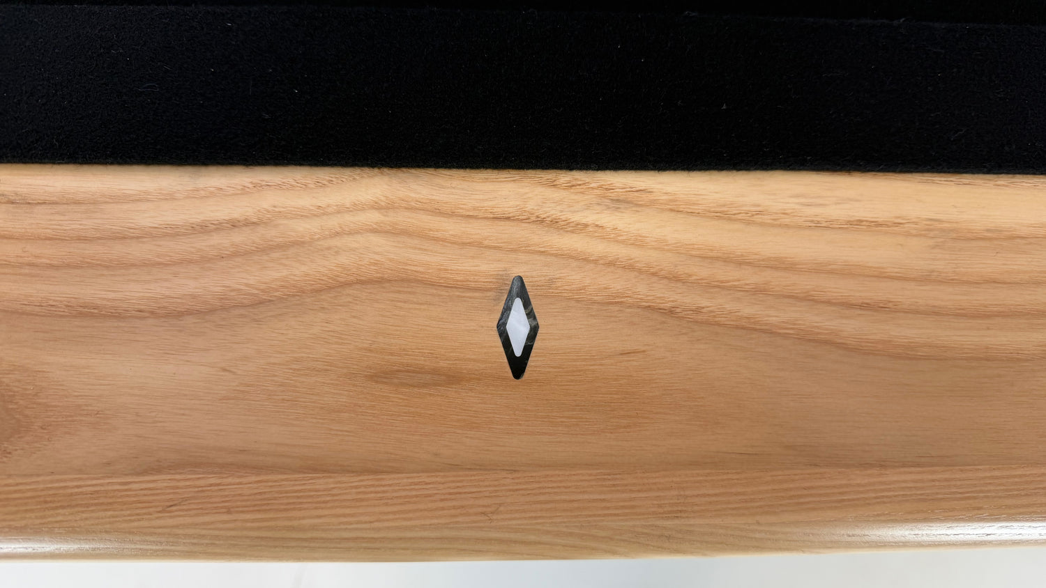 Legacy Billiards Forge Pool Table in Honey Ash Finish with Black Cloth - Rail Site Closeup