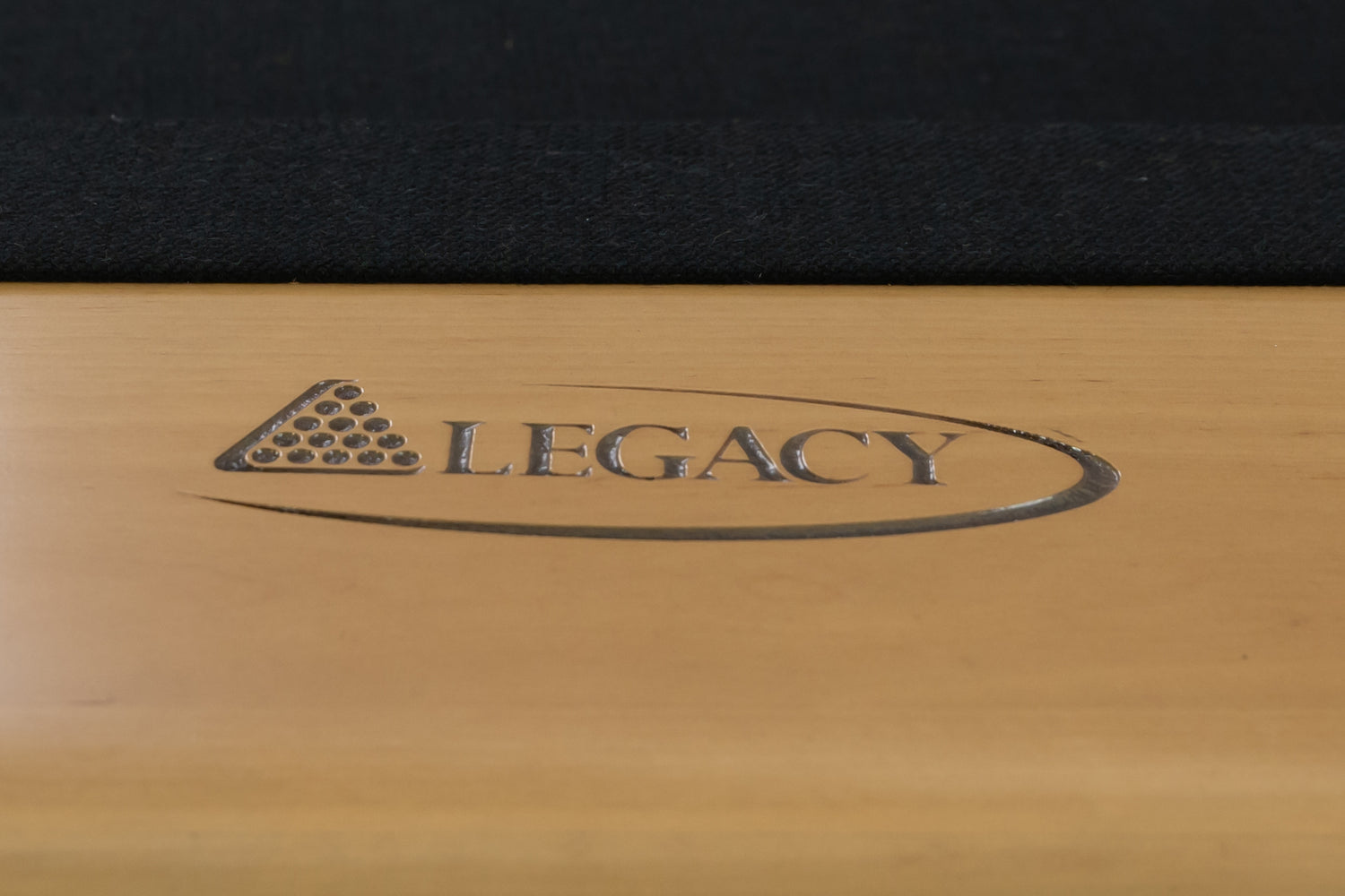 Legacy Billiards Richland Pool Table in Caramel Finish with Black Cloth - Logo Rail Closeup