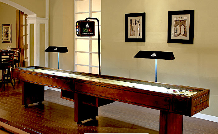 Legacy Billiards Electronic Shuffleboard Scorer Shown on a Shuffleboard Table